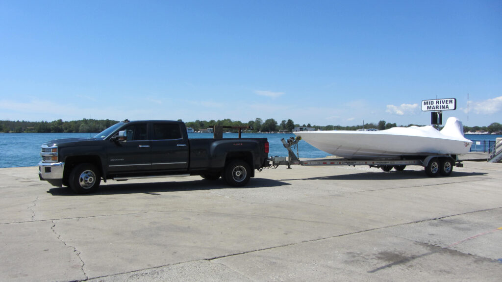 Vehicles parked across the river marina